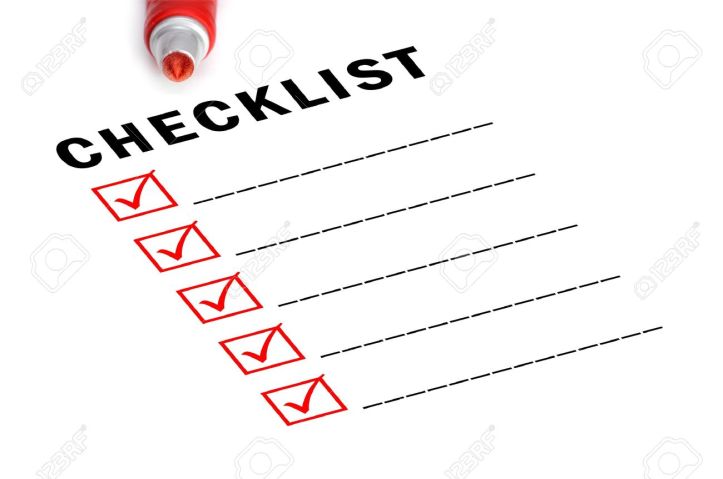 11875927-Checklist-with-red-felt-marker-and-checked-boxes--Stock-Photo
